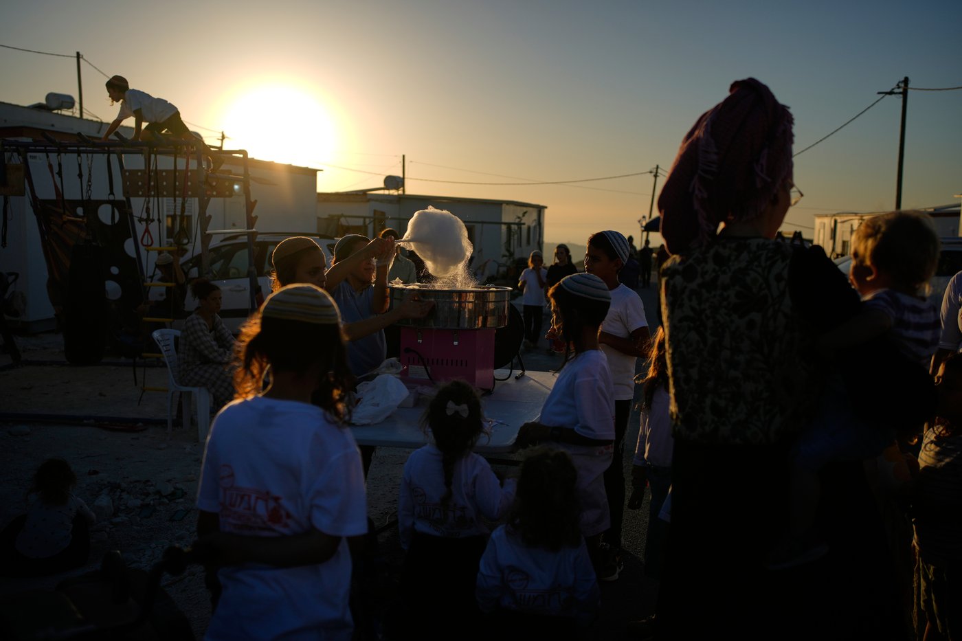 Israeli settlers, some armed, celebrate a new synagogue in the occupied West Bank, in photos | iNFOnews.ca