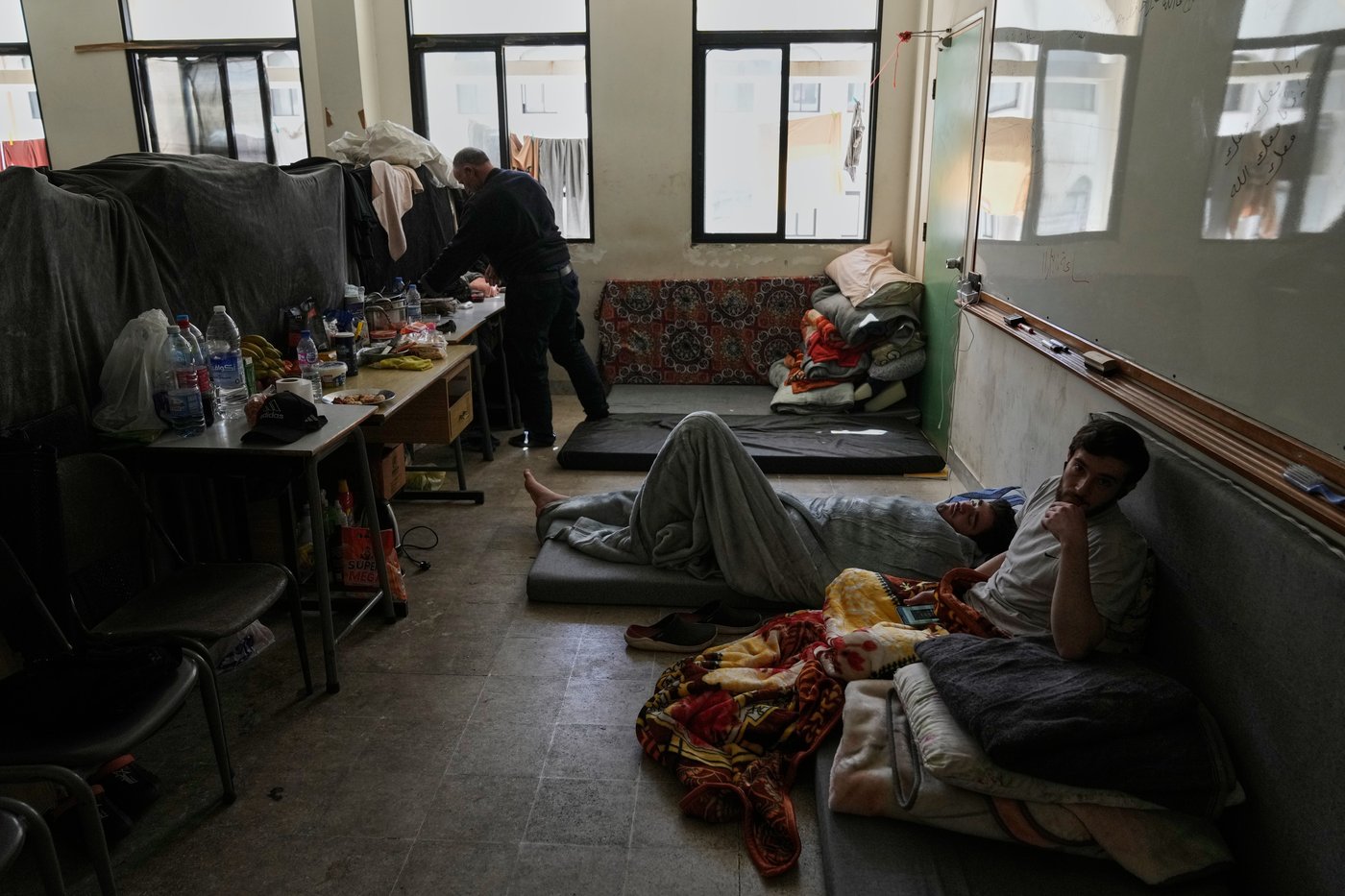 Photos of displaced civilians in Lebanon, where schools and stadiums turn into shelters during war | iNFOnews.ca