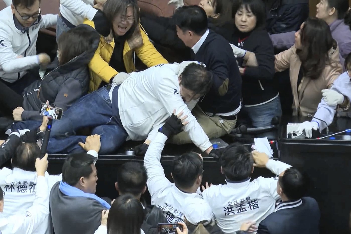 Taiwan lawmakers clash after one party breaks into legislature to occupy speaker's chair | iNFOnews.ca