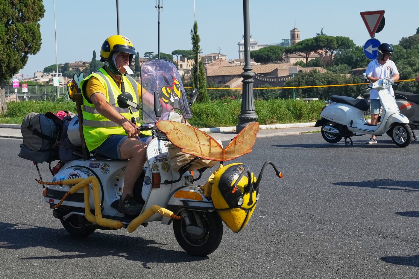 Photos show Vespa enthusiasts buzzing through Rome celebrating the little scooter's 80th anniversary | iNFOnews.ca