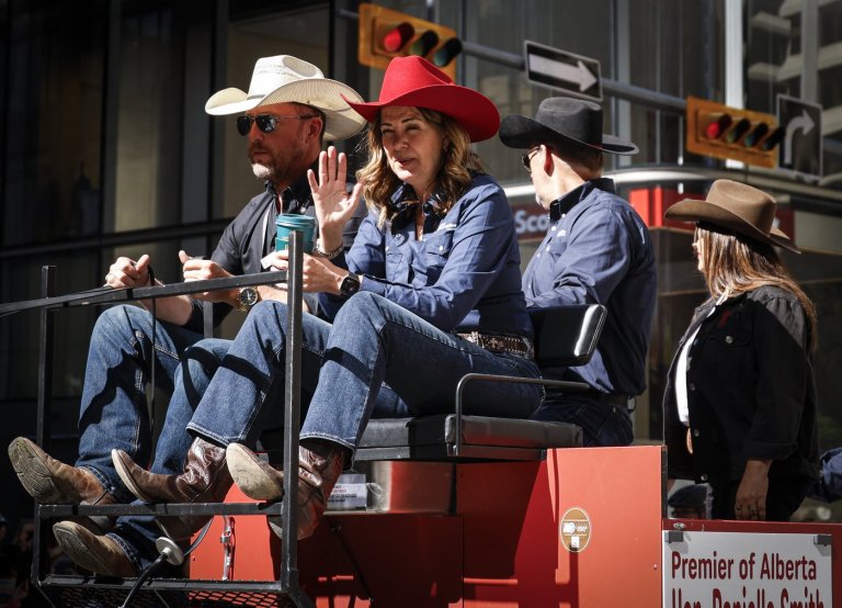 'You suuuuuck!': Smith gets cheers and jeers riding in Calgary Stampede parade | iNFOnews.ca
