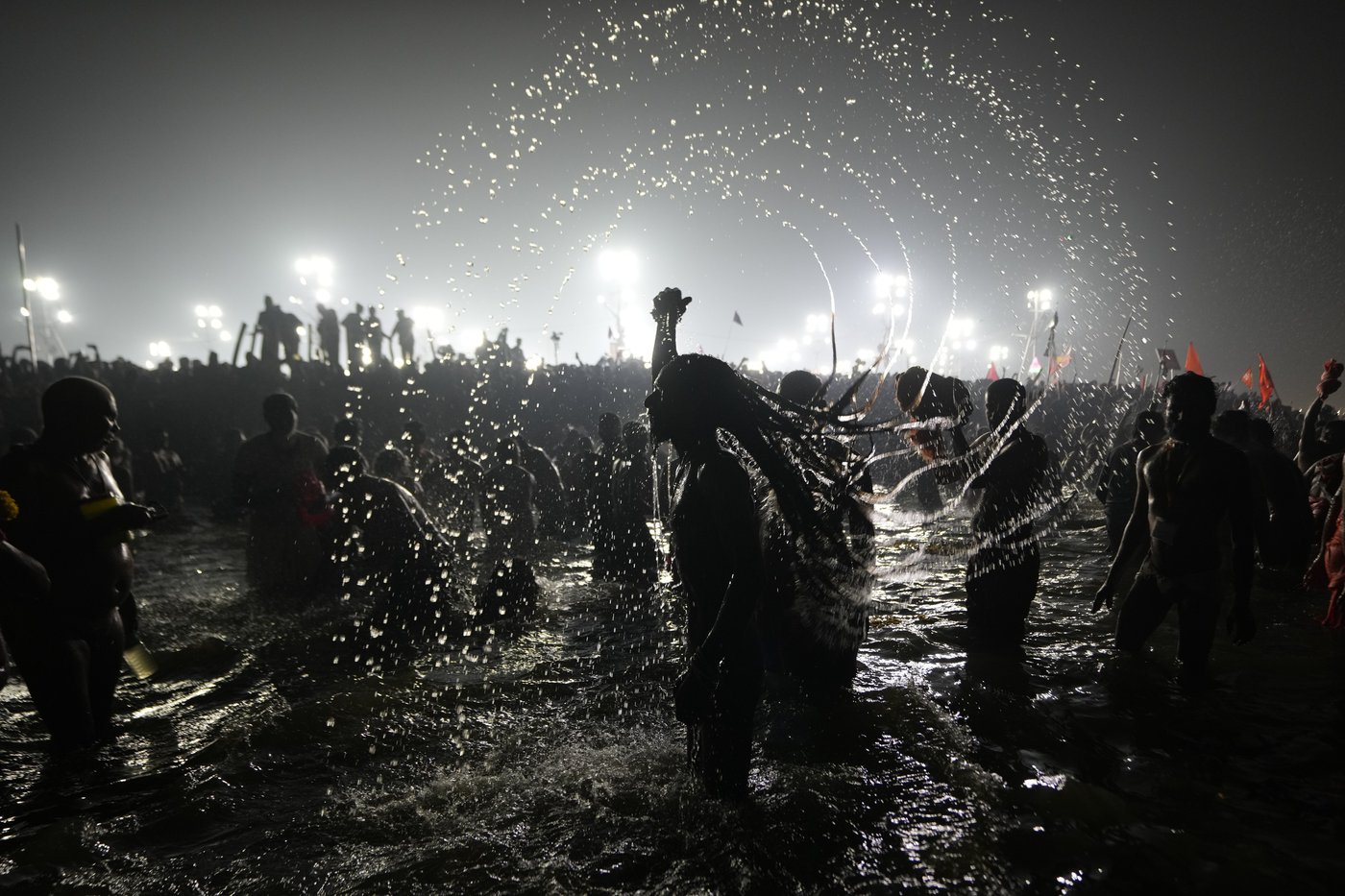 Hindu ascetic rising from the river after a holy dip is emblematic of Maha Kumbh festival in India | iNFOnews.ca Hindu ascetic rising from the river after a holy dip is emblematic of Maha Kumbh festival in India | iNFOnews.ca