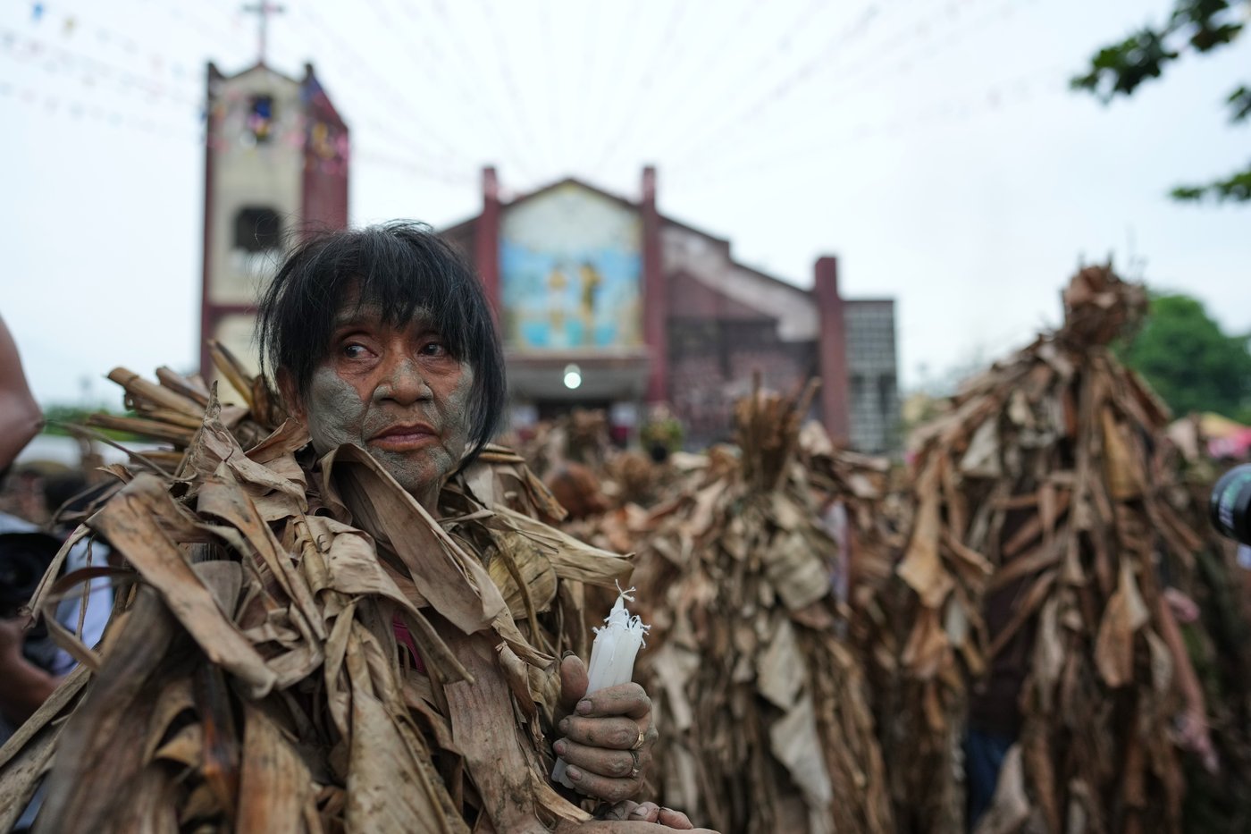 Photos show Philippine Catholics smearing mud on their bodies for festival honoring John the Baptist | iNFOnews.ca