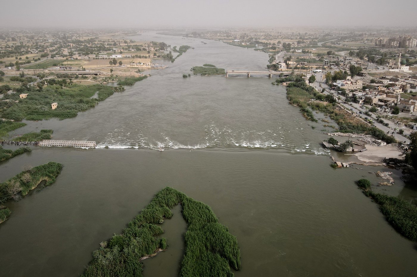 Photos of rare Euphrates River flooding forcing Syrians inland | iNFOnews.ca