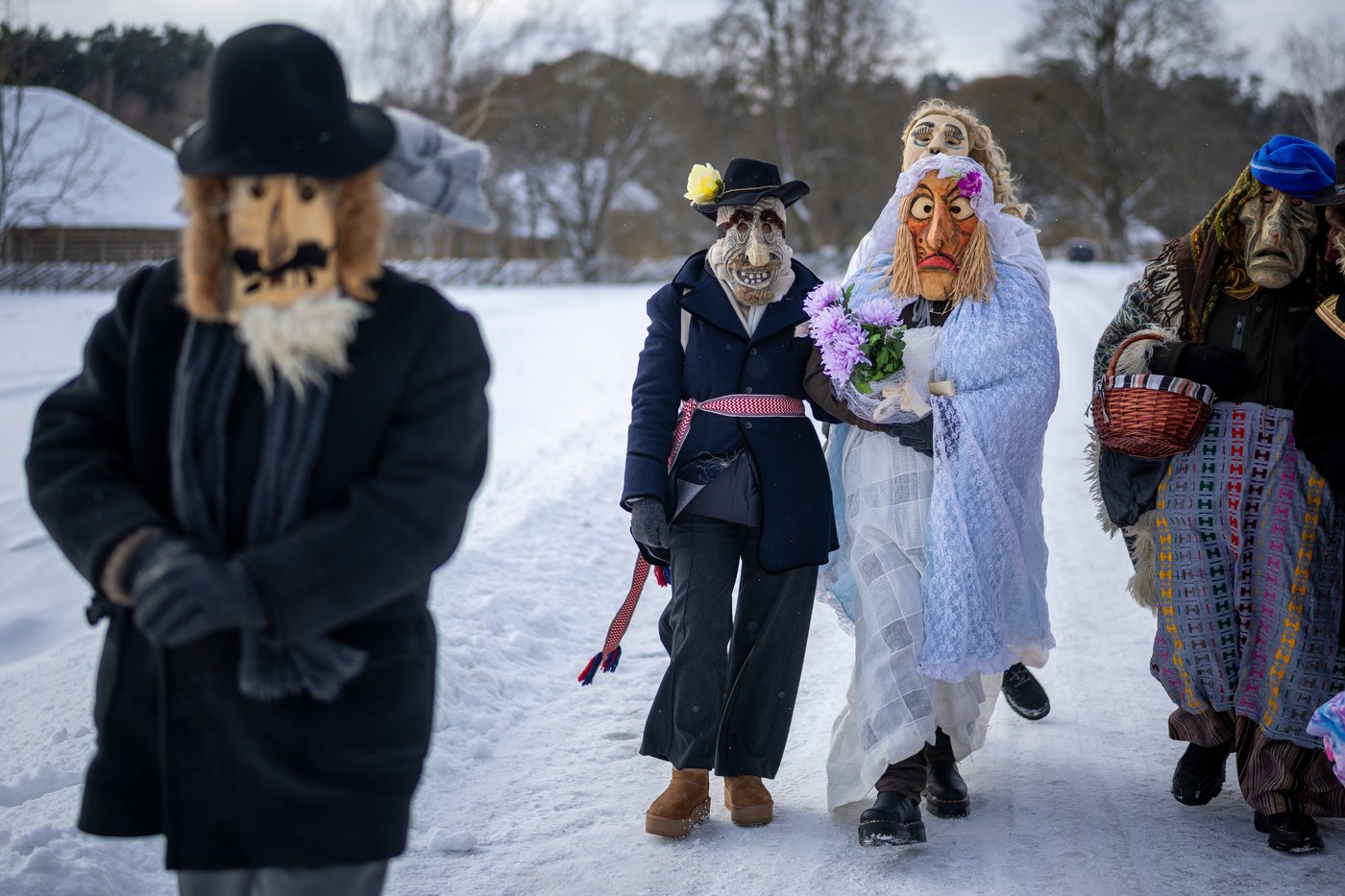 Photos show masked revelers celebrating Shrovetide in Lithuania | iNFOnews.ca