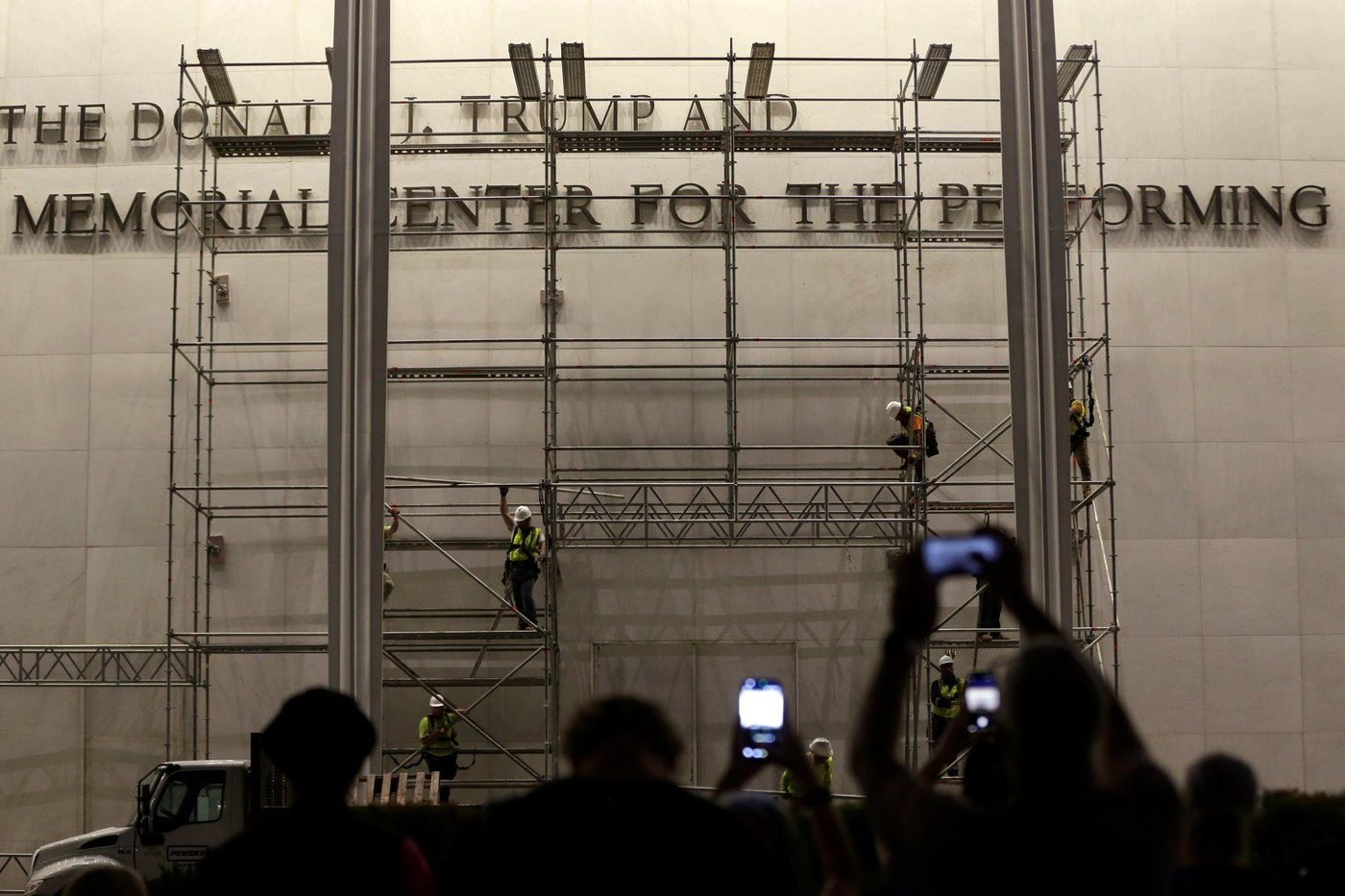 Workers prepare to remove Trump's name from the Kennedy Center, in photos | iNFOnews.ca