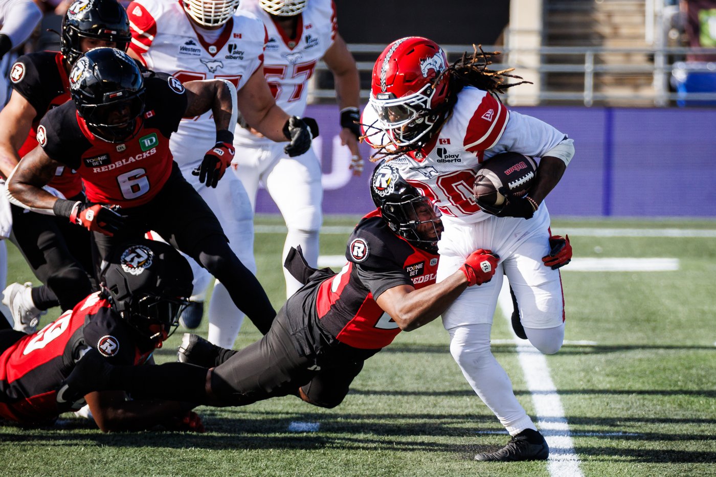 Stampeders keep playoff hopes alive with 45-31 victory over winless Redblacks | iNFOnews.ca Stampeders keep playoff hopes alive with 45-31 victory over winless Redblacks | iNFOnews.ca