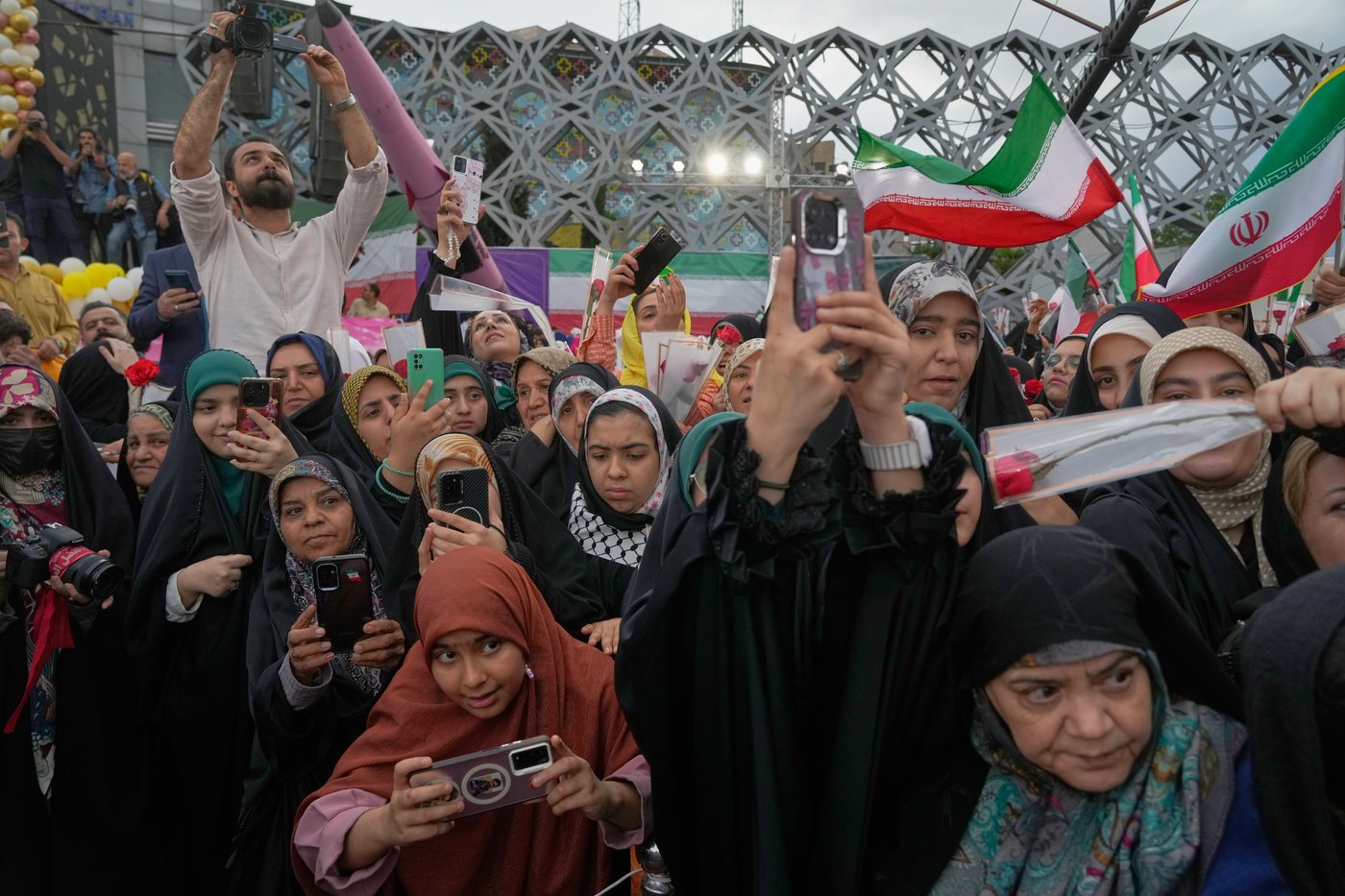 Photos of a mass wedding and a colorful missile at Tehran's 'Sacrifice for Iran' ceremony | iNFOnews.ca