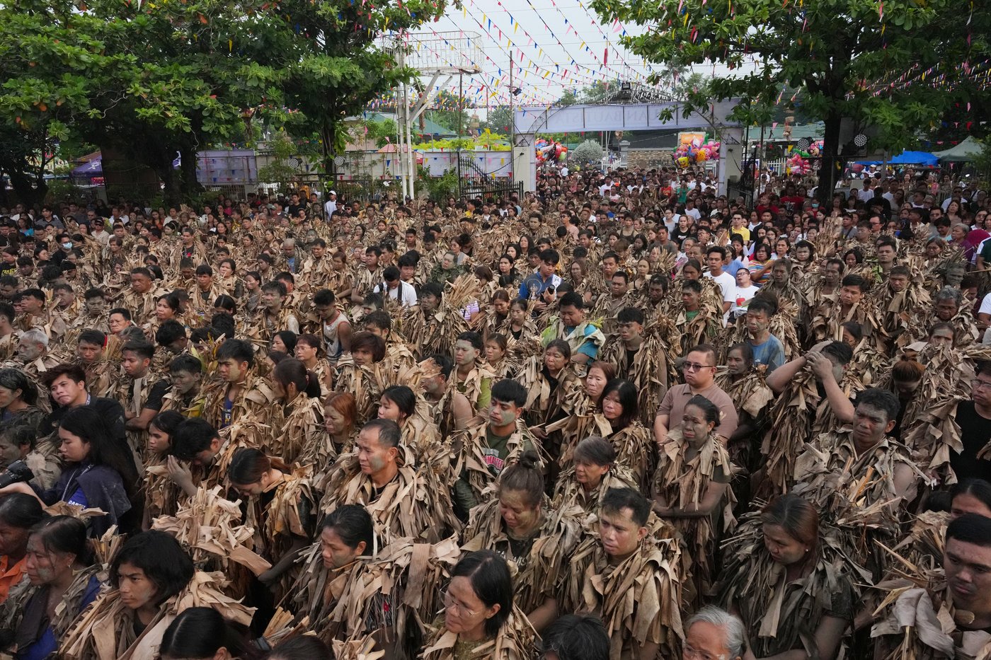 Photos show Philippine Catholics smearing mud on their bodies for festival honoring John the Baptist | iNFOnews.ca