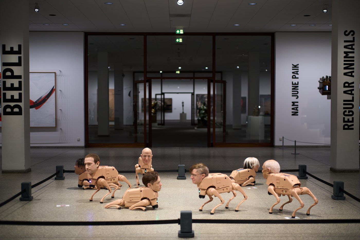 Robot dogs with Musk and Zuckerberg heads roam around Berlin museum in Beeple's new exhibit | iNFOnews.ca