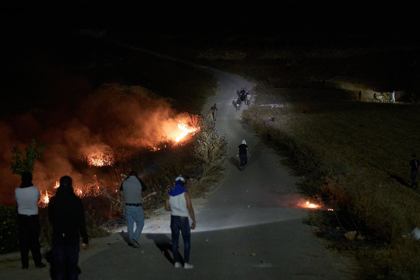 Photos show West Bank Palestinians keeping watch at night as settler violence grows | iNFOnews.ca