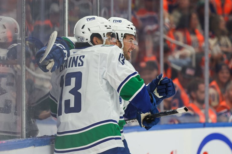 Cotter's OT winner caps two-goal night as Canucks outlast Oilers 6-5 to start season | iNFOnews.ca