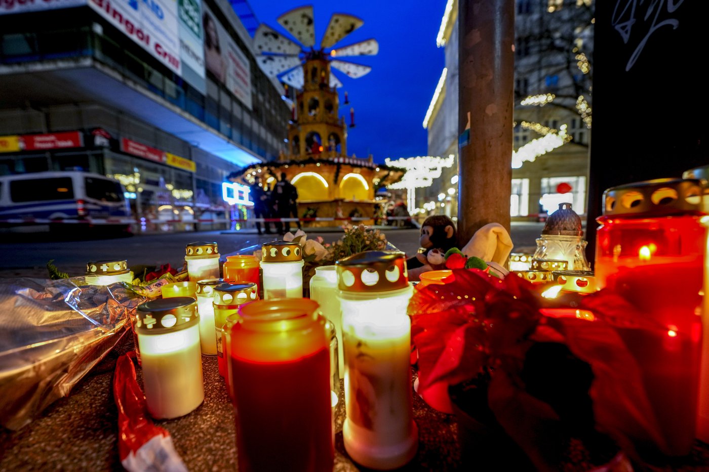 Germans mourn the 5 killed and 200 injured in the apparent attack on a Christmas market | iNFOnews.ca