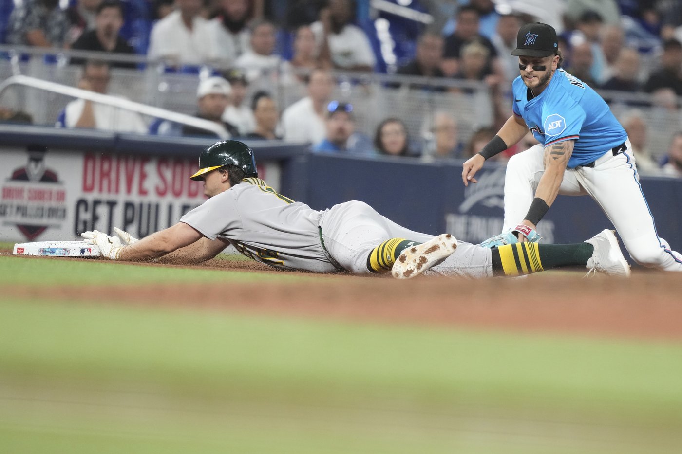 Kurtz triples, scores and Ferguson retires 3 straight in the 9th to lift A's over Marlins 3-2 | iNFOnews.ca