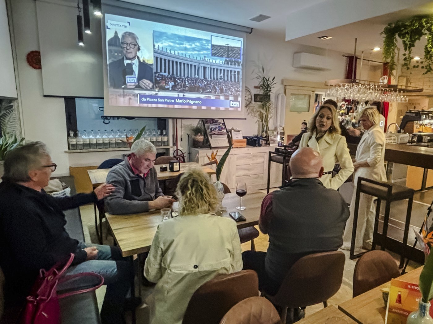 Locals gather for red wine spritz and conclave watch in a cardinal's hometown | iNFOnews.ca