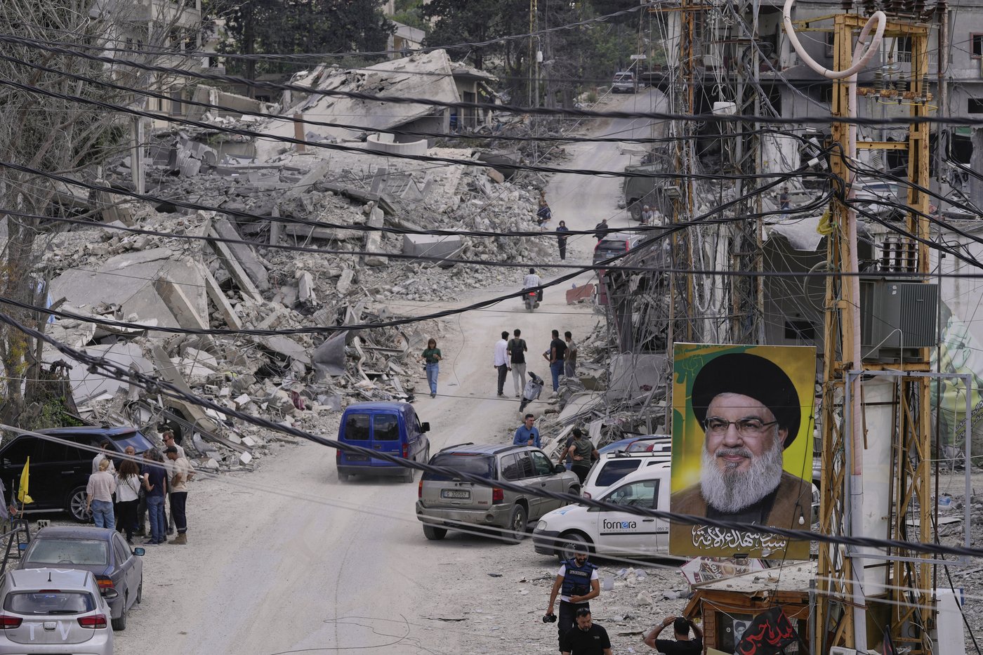 Lebanese return home to destruction after word of an initial US-Iran deal, in photos | iNFOnews.ca