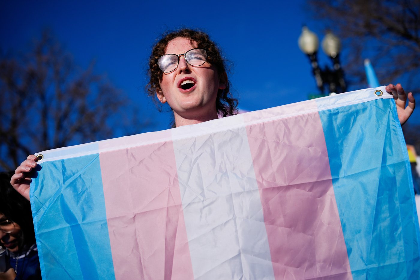 Photos of demonstrators outside the Supreme Court as it considers upholding transgender sports bans | iNFOnews.ca