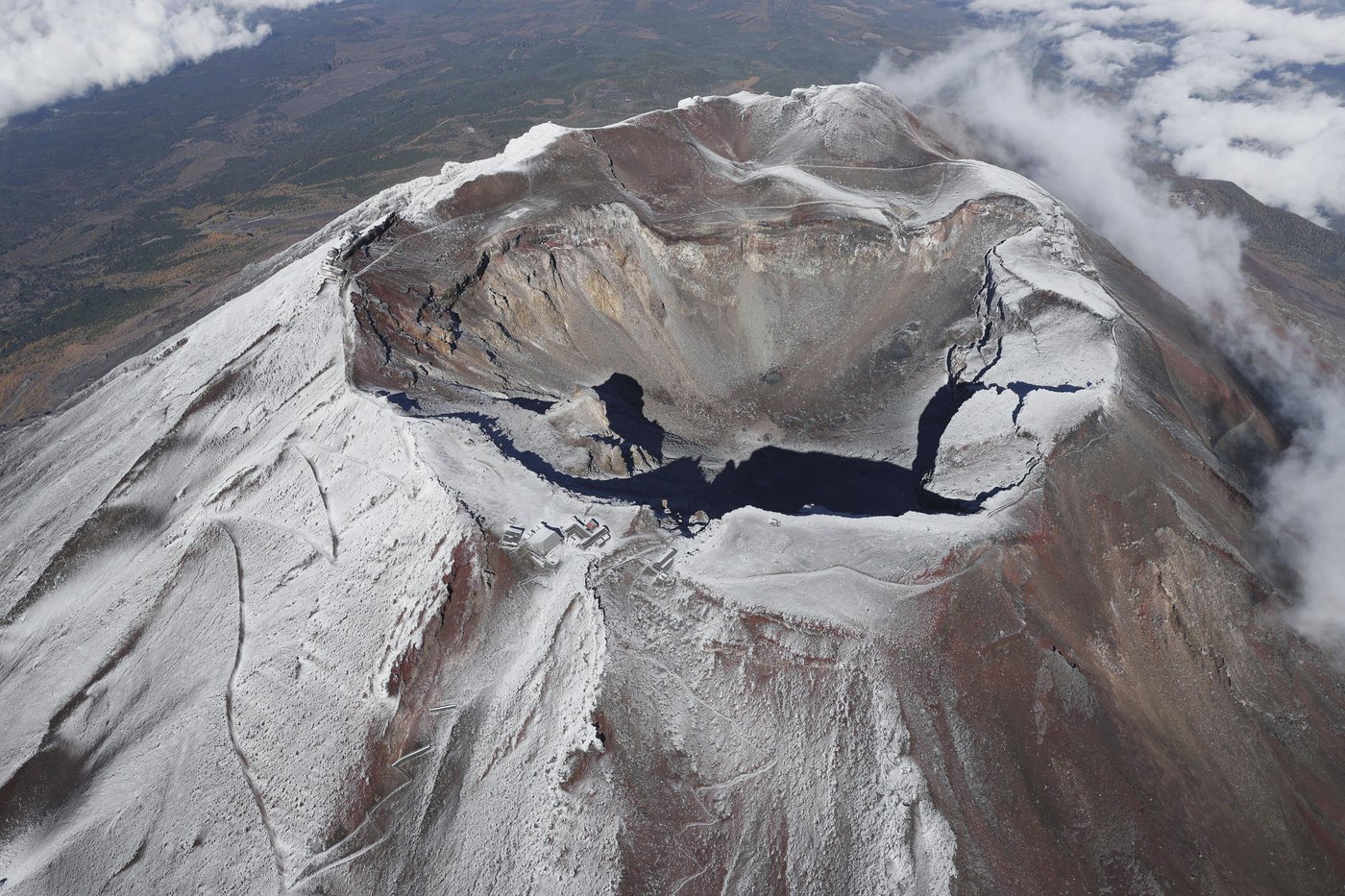 It's not official yet but Mount Fuji gets its trademark snowcap after the longest delay in 130 years | iNFOnews.ca