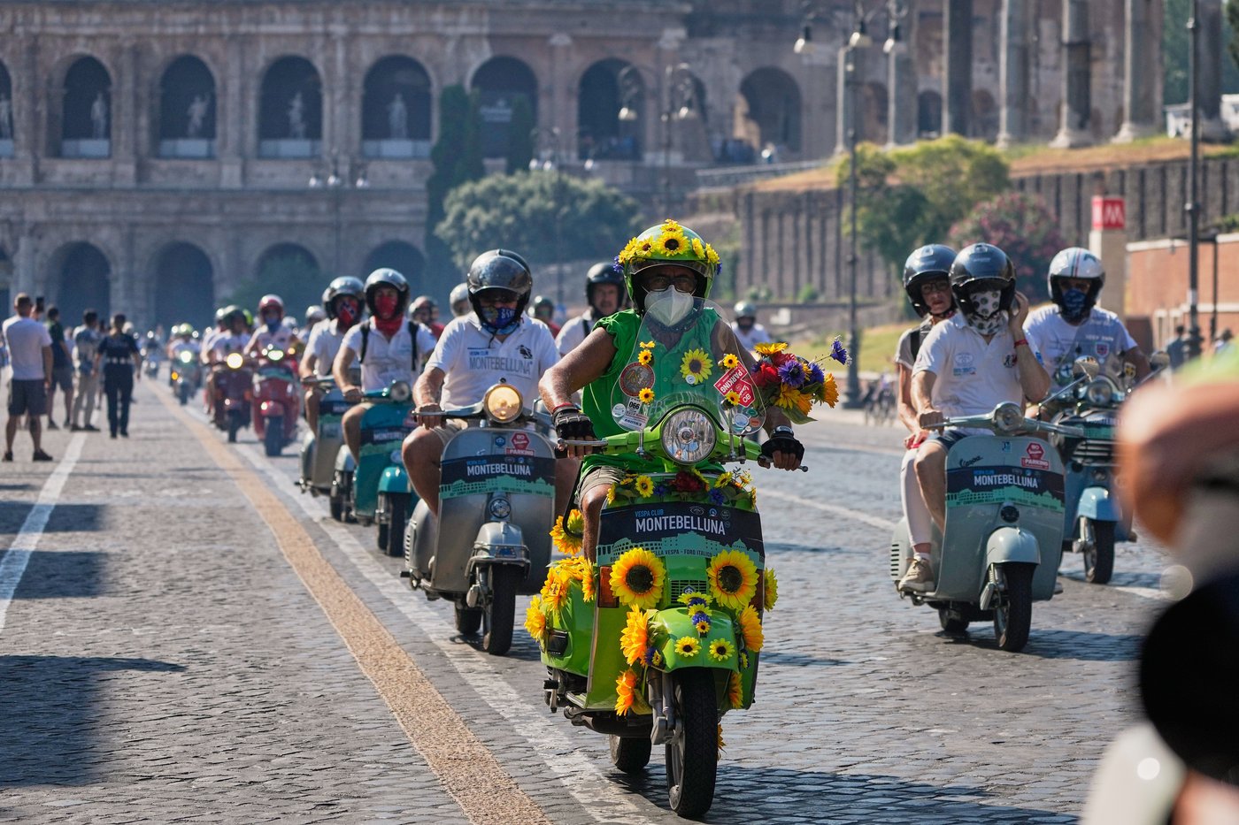 Photos show Vespa enthusiasts buzzing through Rome celebrating the little scooter's 80th anniversary | iNFOnews.ca