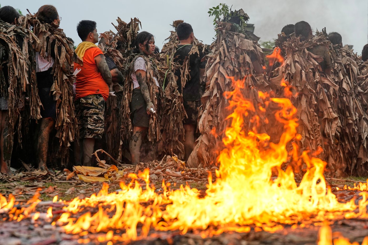 Photos show Philippine Catholics smearing mud on their bodies for festival honoring John the Baptist | iNFOnews.ca