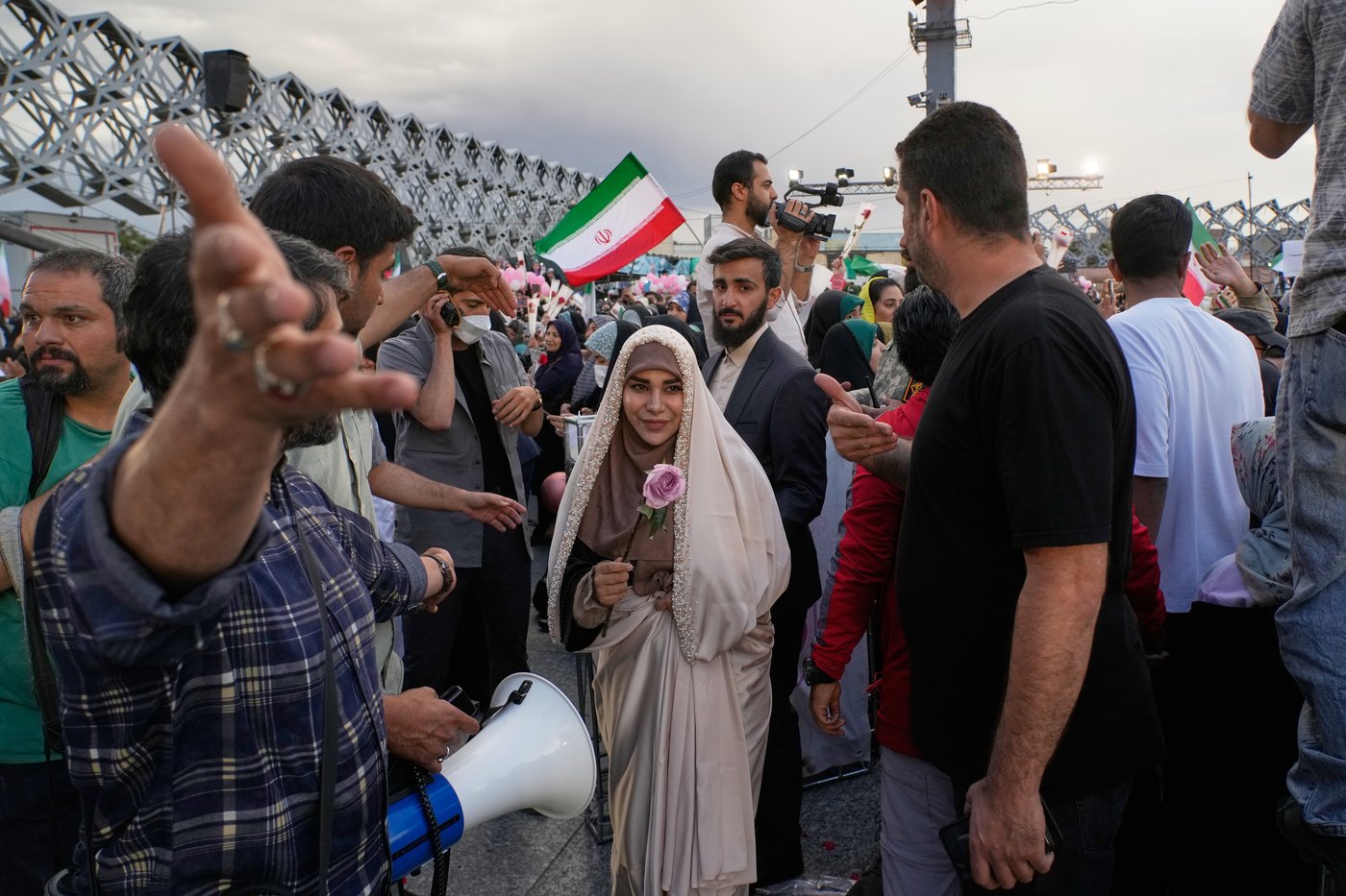 Photos of a mass wedding and a colorful missile at Tehran's 'Sacrifice for Iran' ceremony | iNFOnews.ca