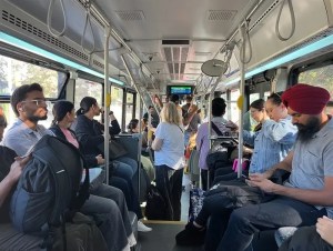 People riding a transit bus.