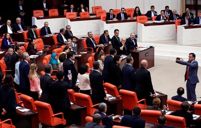 Turkish lawmaker chains self to rostrum, sparks new brawl | iNFOnews.ca