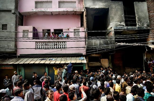 At least 13 workers die in garment factory fire in India | iNFOnews.ca