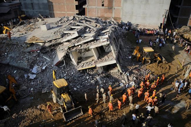 Building collapses into another near Indian capital, 3 die | iNFOnews.ca