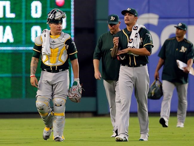 A's Maxwell takes to knee in bullpen during anthem in Texas | iNFOnews.ca CP485918845