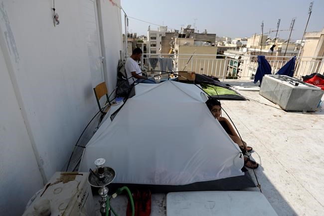 The Latest: Greeks rescue 31 migrants from crippled boat | iNFOnews.ca