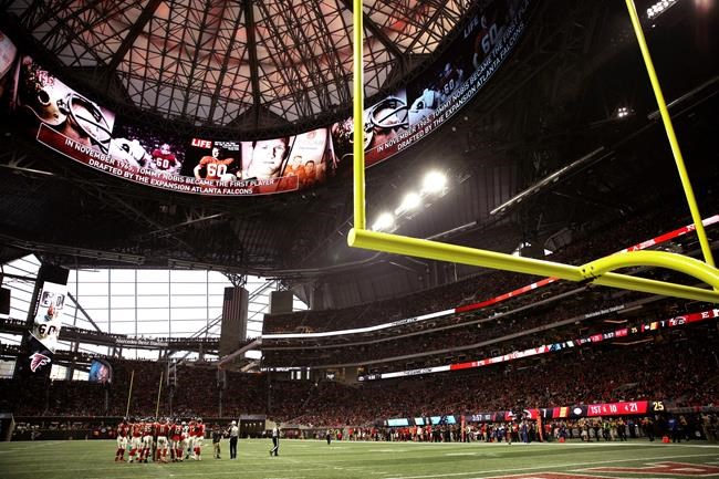 A few dozen protesters in cold rain outside the big game | iNFOnews.ca