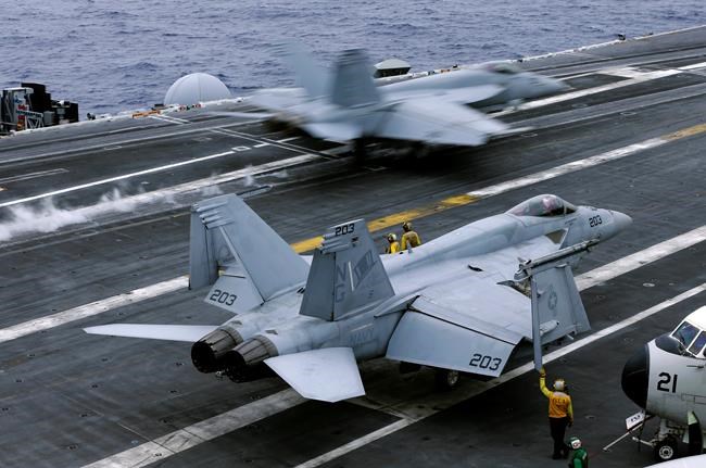 Chinese shadow US aircraft carrier on South China Sea patrol | iNFOnews.ca CP66371517