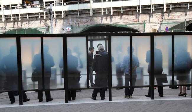 Japan OKs 1st anti-smoking law seen as lax and partial | iNFOnews.ca
