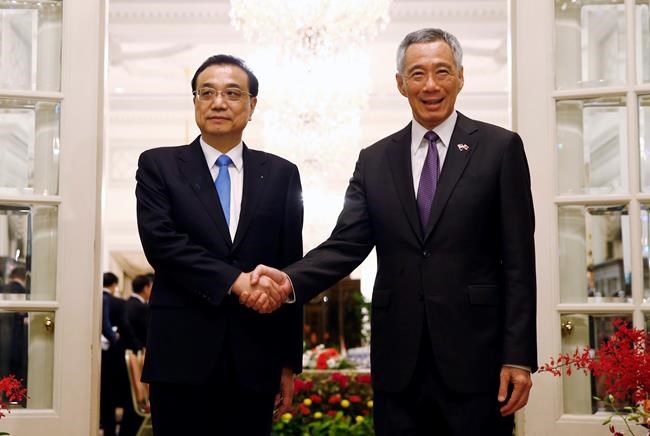 Chinese premier urges guard of free trade on Singapore visit | iNFOnews.ca CP49654815
