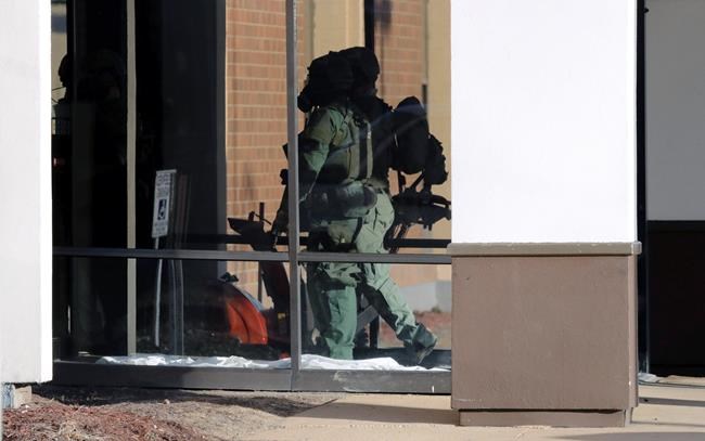 The Latest: Male, female among dead in hotel standoff | iNFOnews.ca