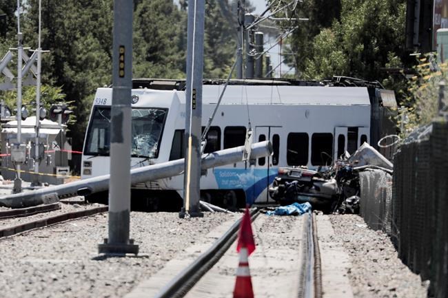 Video shows train hitting, pushing car near patio; 2 killed | iNFOnews.ca
