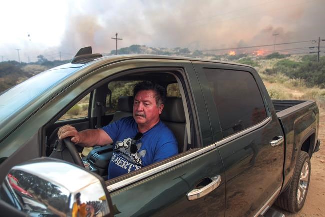 The Latest: Containment begins on LA-area wildfires | iNFOnews.ca CP213696309