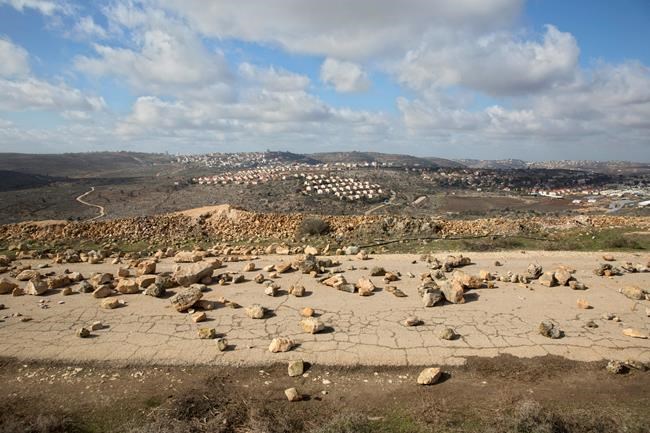 Israeli forces begin evacuating 9 settler homes in West Bank | iNFOnews.ca CP27965041
