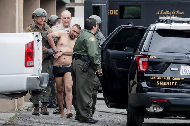 Man arrested in killing of 1 officer, wounding of another | iNFOnews.ca