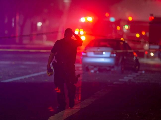 The Latest: Police say gunman on bike ambushed slain officer | iNFOnews.ca