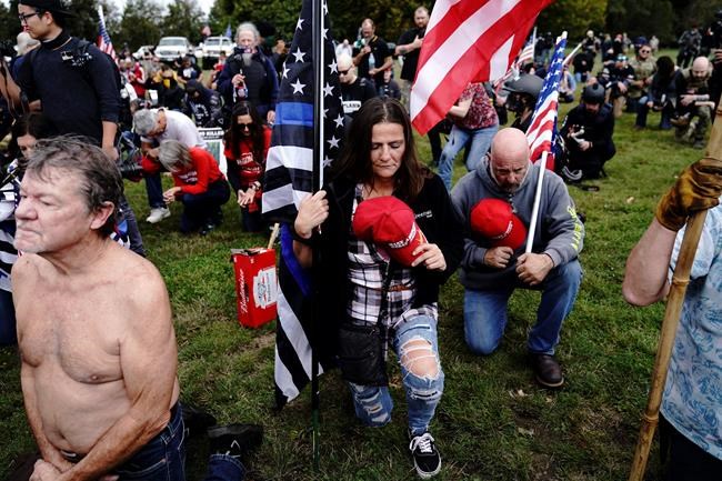 Woman charged in Capitol melee says Proud Boys recruited her | iNFOnews.ca