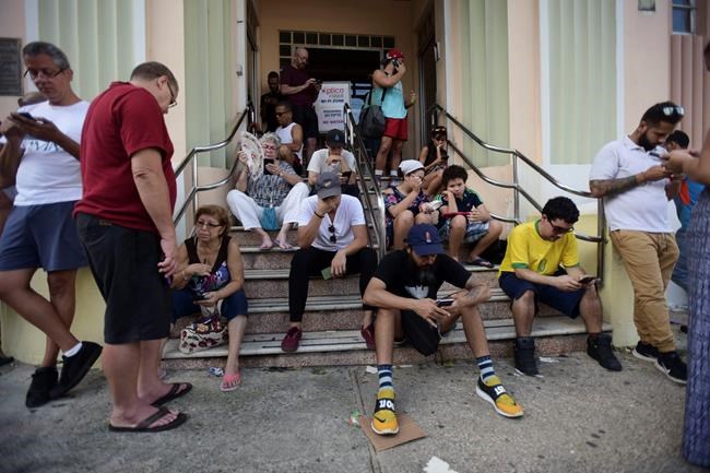 Puerto Ricans hunt for precious Wi-Fi and cell signals | iNFOnews.ca Puerto Ricans hunt for precious Wi-Fi and cell signals | iNFOnews.ca