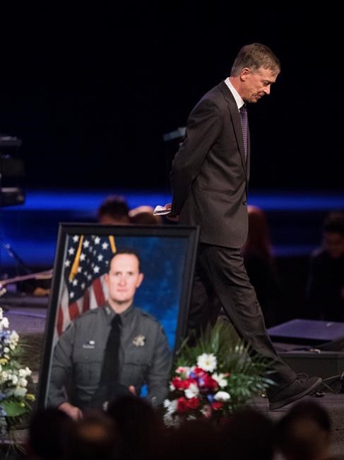 Slain deputy remembered as a 'great hero' at funeral | iNFOnews.ca