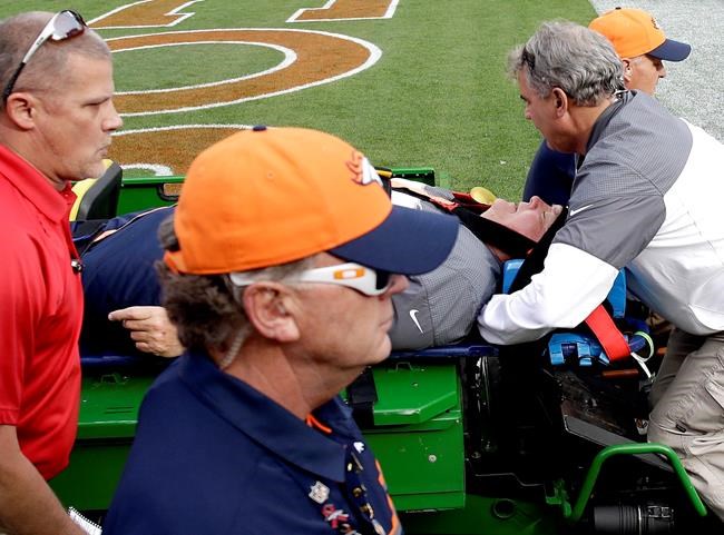 The Latest: Broncos co-ordinator upended, carted off field | iNFOnews.ca
