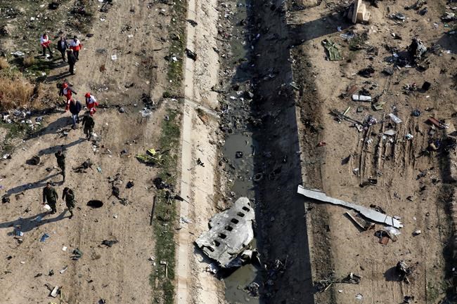 Vigils held for plane crash victims and assisted dying; In The News for Jan. 13 | iNFOnews.ca CP2030560909