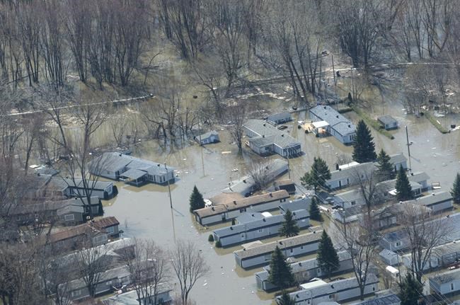 Charges after car slams into office helping flood victims in Ste-Marthe-sur-le-Lac | iNFOnews.ca