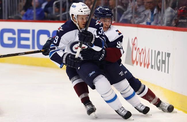 Jets defenceman Enstrom out indefinitely with a concussion after Sestito hit | iNFOnews.ca CP575982699