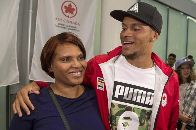 Andre De Grasse trades spikes for books, fulfilling promise to mom | iNFOnews.ca