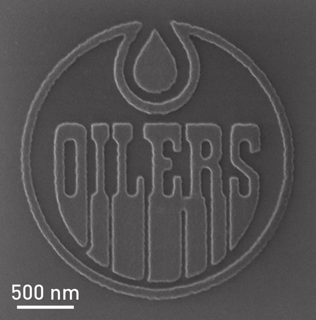 Nanotechnology team creates Oilers logo so small 900 million fit on top of puck | iNFOnews.ca